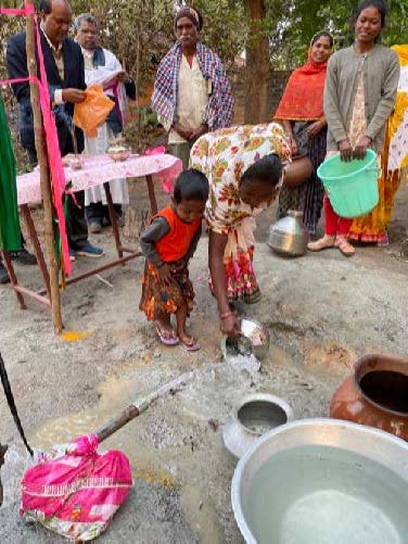 A priest of the Diocese of Jasphpur, India, blesses the new well that provides clean drinking water in the village of Semartal.
